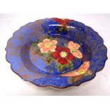 A Royal Doulton shaped shallow dish decorated with flowers,