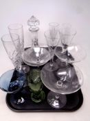 A tray containing assorted glassware to include ship's decanter, a hand blown green glass goblet,