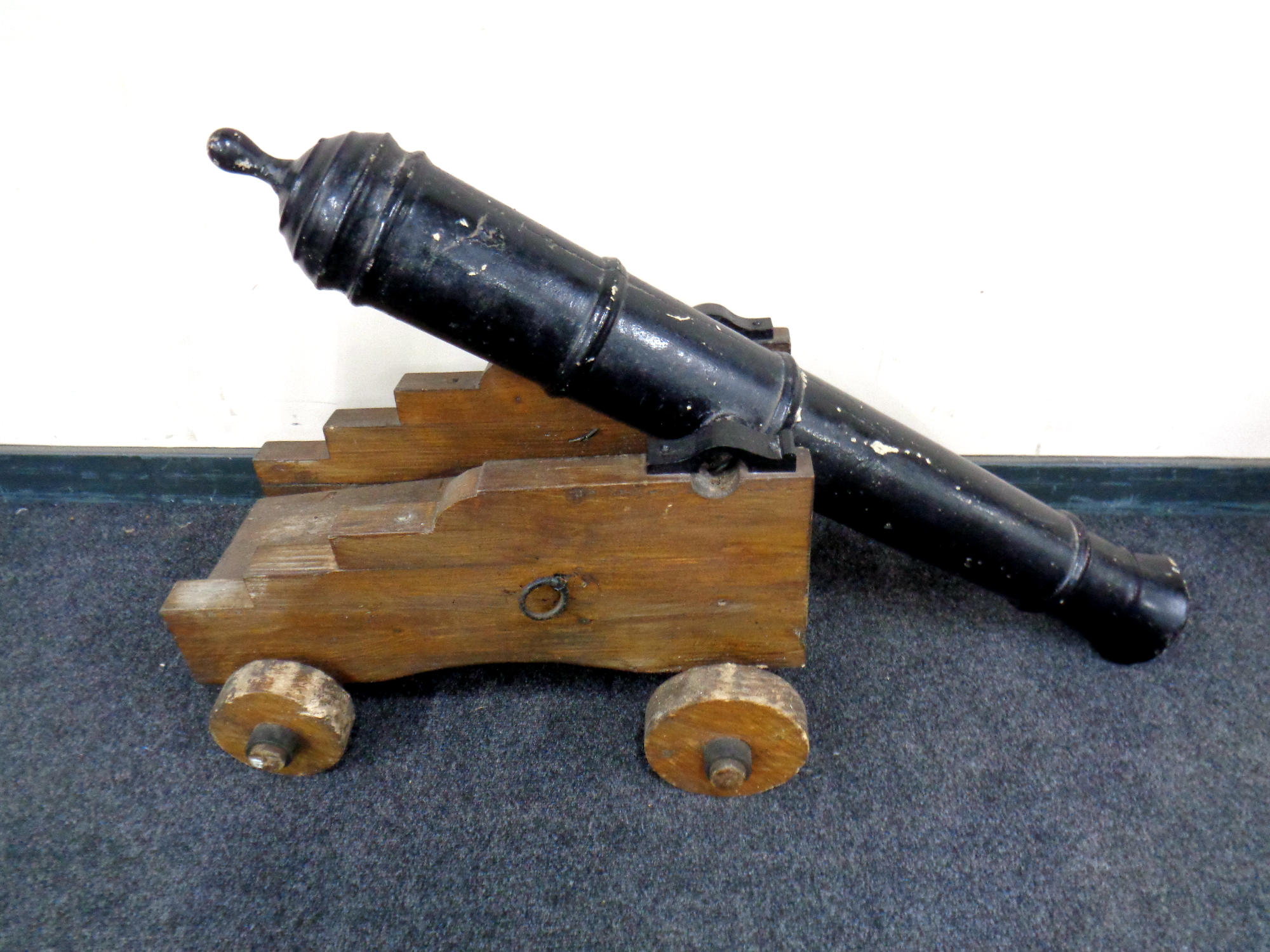 A composition-barrelled cannon on wooden trolley,