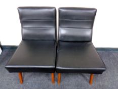 A pair of mid 20th century black vinyl upholstered bedroom chairs