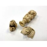 A Japanese ivory netsuke, a carved ivory buckle and one further carving.