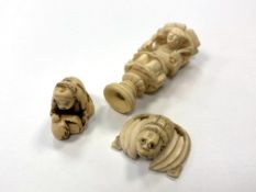 A Japanese ivory netsuke, a carved ivory buckle and one further carving.