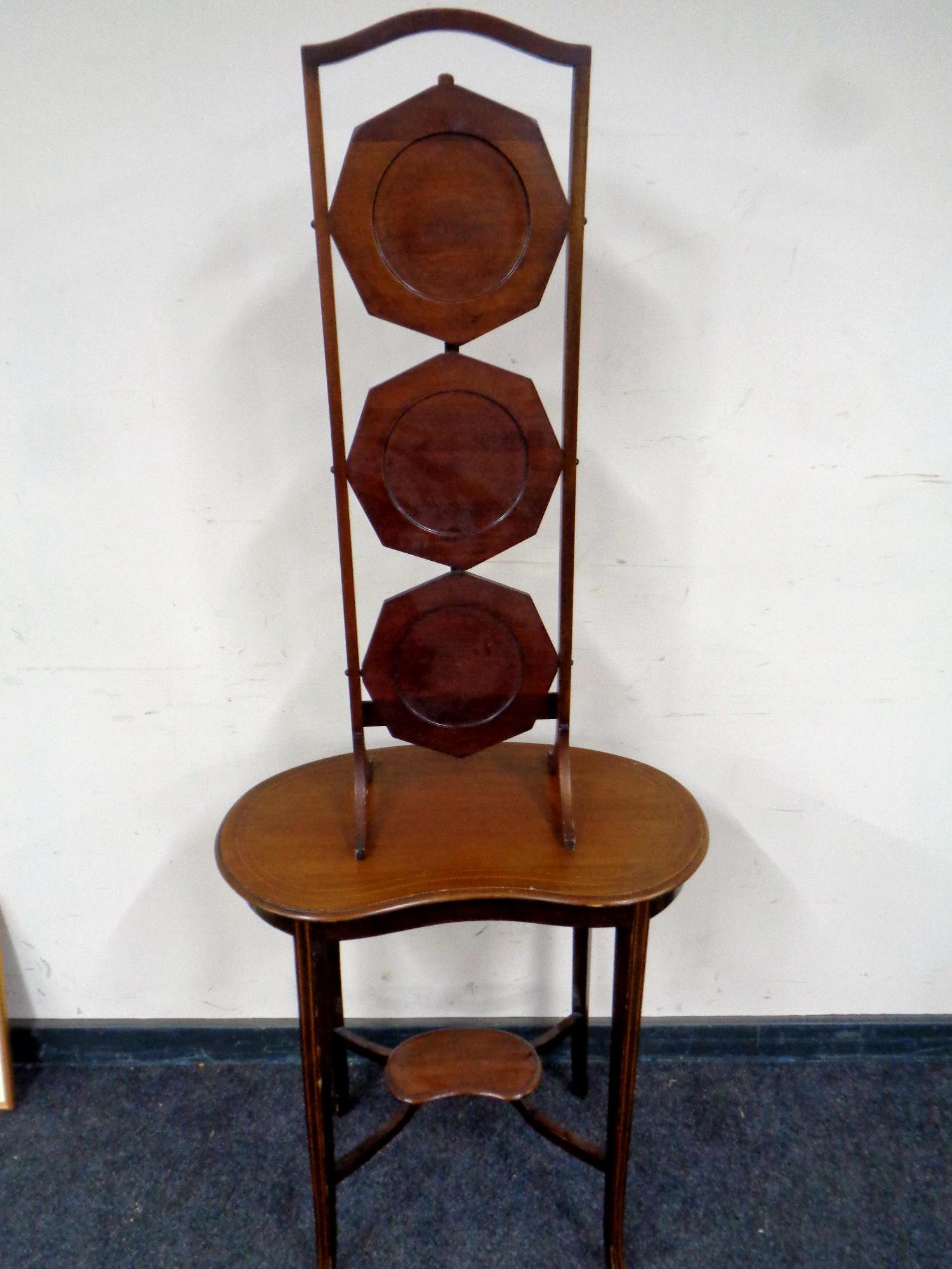 An Edwardian inlaid mahogany kidney shaped occasional table together with a mahogany folding cake