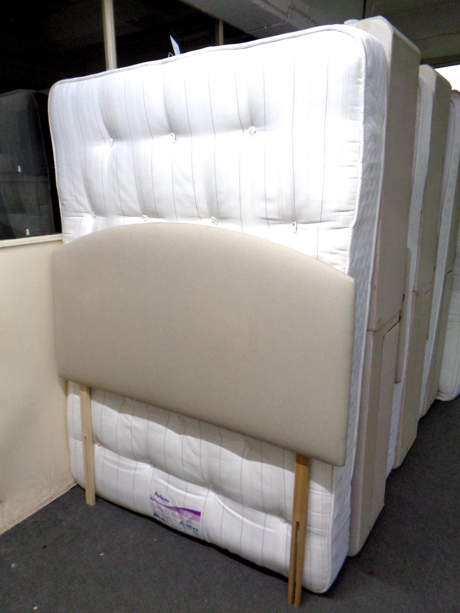 A 4'6 storage divan set with Perfecta Back Care firm mattress