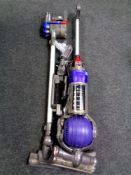 A Dyson DC 24 ball vacuum together with a Dyson DC 35 hand held vacuum,