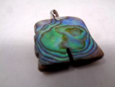 A silver mother of pearl pendant