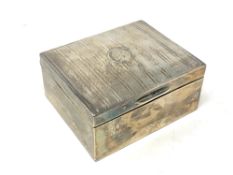 A silver cigarette box,