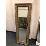 A contemporary mirror in golden frame