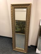 A contemporary mirror in golden frame