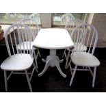A painted Julian Bowen drop leaf kitchen table and four chairs