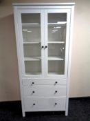 An Ikea painted pine double door bookcase fitted three drawers beneath