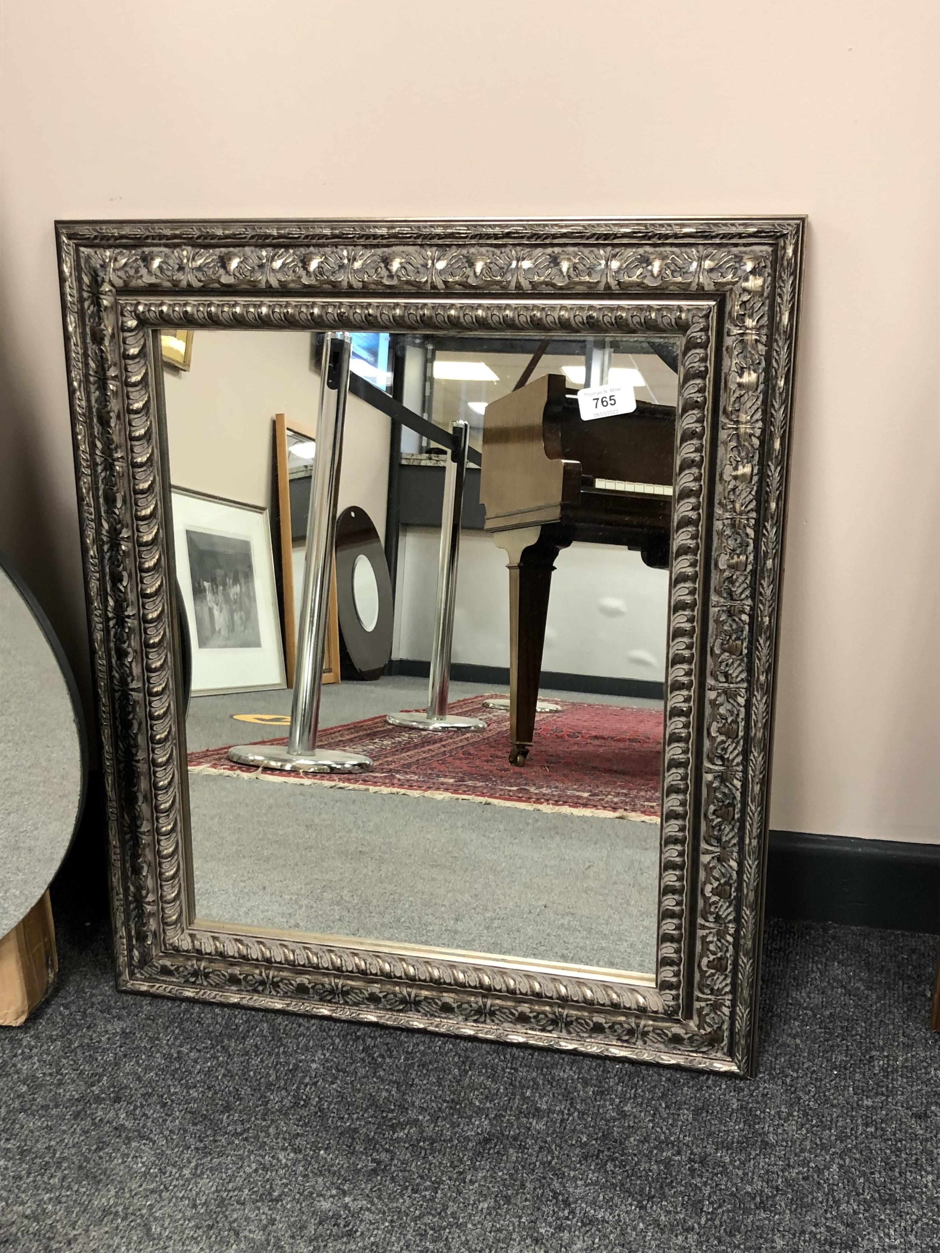 A modern mirror in golden frame