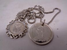 An 1887 shilling and further coin on chain