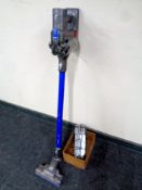 A Dyson DC44 Animal hand held vacuum together with wall mounting bracket and charger