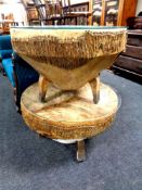 Two circular animal hide drum tables with glass tops