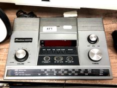 A vintage Binatone moon time clock radio