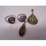 Four silver marcasite items including rings,