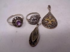 Four silver marcasite items including rings,