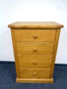 A contemporary oak four drawer chest,