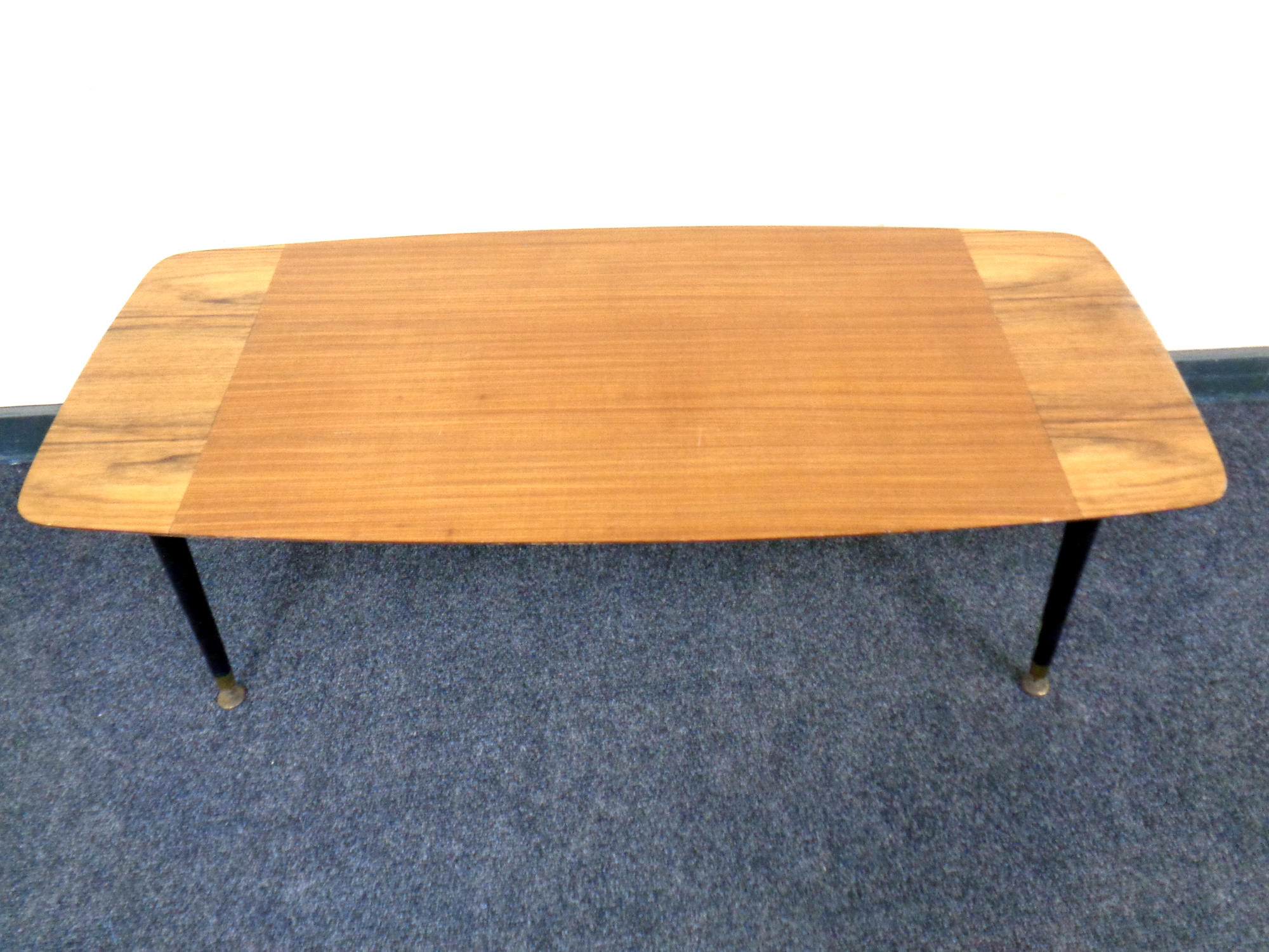 A mid 20th century teak veneered coffee table