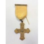A silver cross medal dated 1867-1967