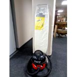 A Henry vacuum with hose together with an ironing board (new)