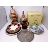 A box containing oriental style ceramics to include boxed collector's plates,