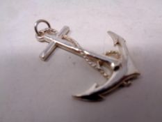 A silver anchor pendant