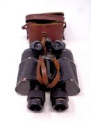 A pair of early 20th century Lewco of Paris 8 x 25 field glasses in a fitted leather case together