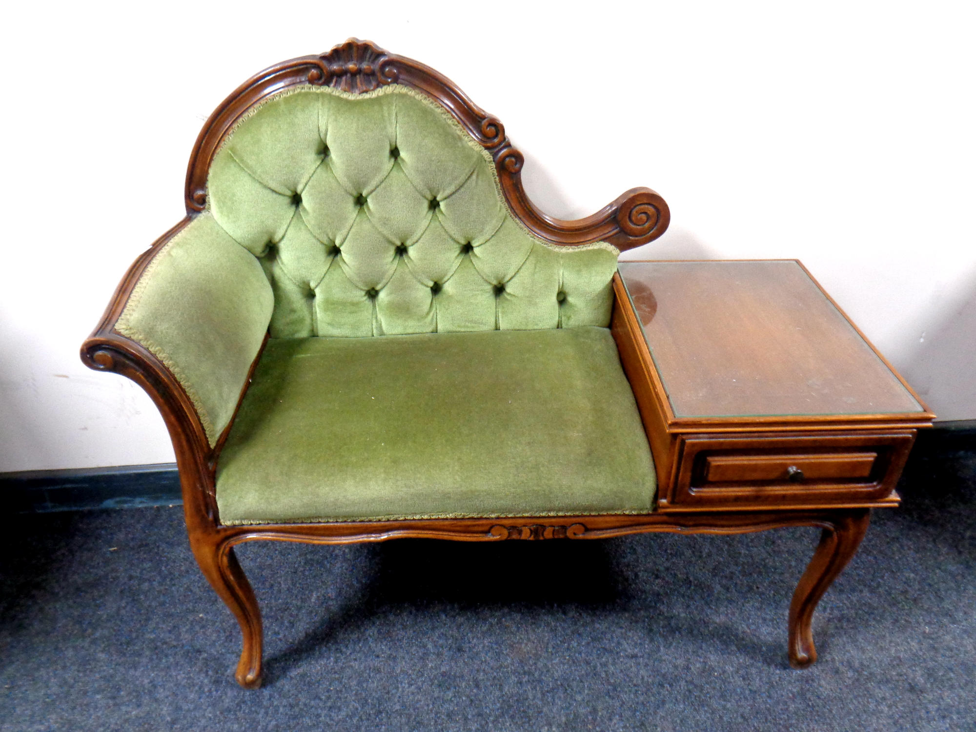 An Italian style telephone table upholstered in a green dralon