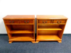 A pair of inlaid yew wood open bookshelves fitted two drawers above, width 75.