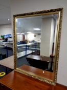 A gilt framed bevel edged overmantel mirror,