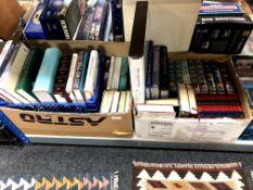Two boxes and a crate containing assorted hardback books to include novels, non fiction,