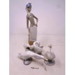 Three Lladro duck figures together with a further Lladro figure,