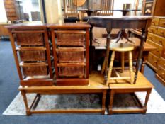 A pair of stained pine and wicker three drawer chests together with a D shaped hall table,