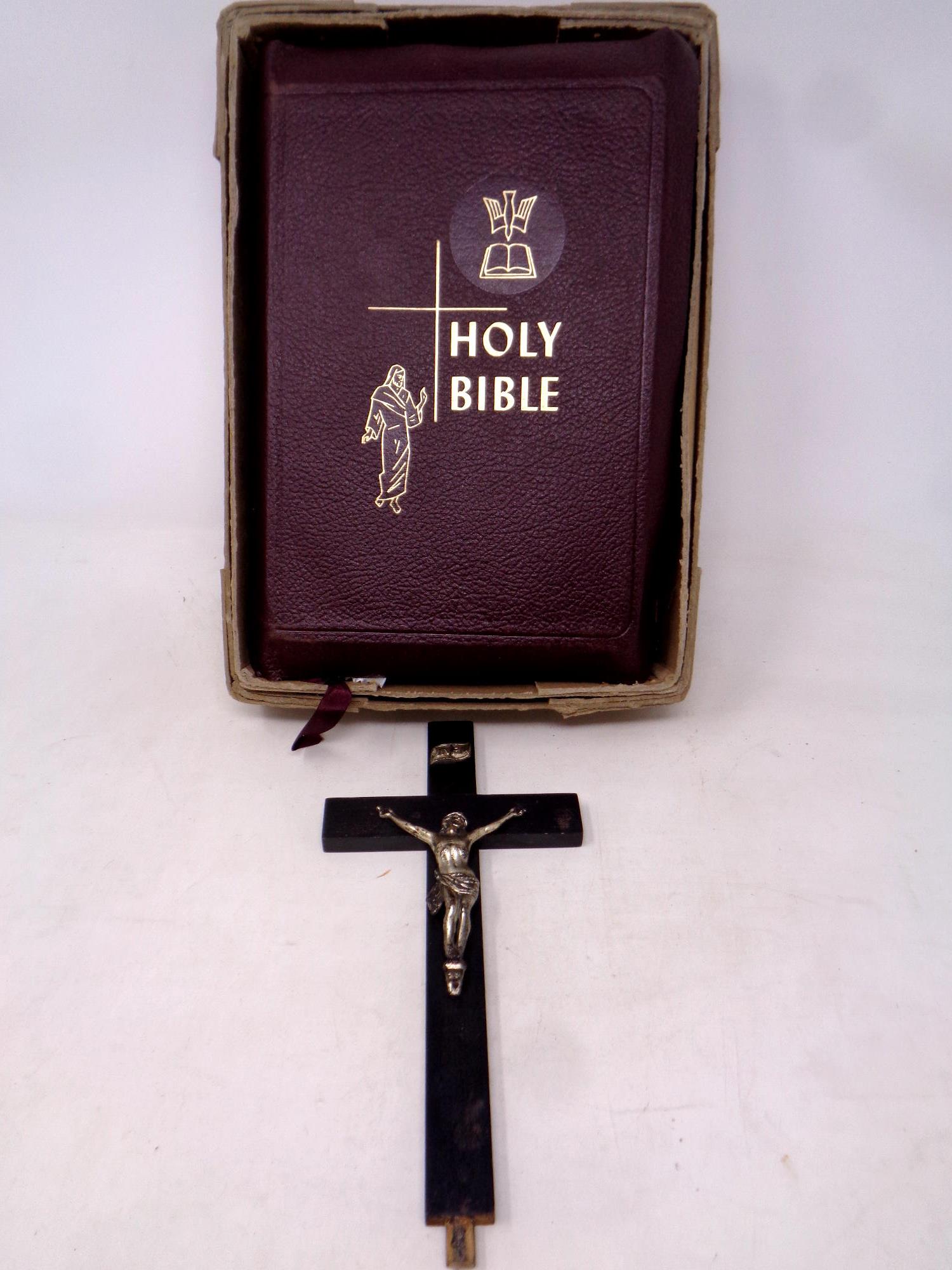 A Catholic Press leather bound holy bible together with a crucifix