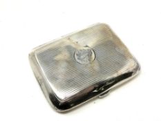 A silver cigarette case CONDITION REPORT: 83.7g. Some dents.