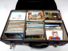 A suitcase containing a vast quantity of 20th century postcards to include continental and tourist