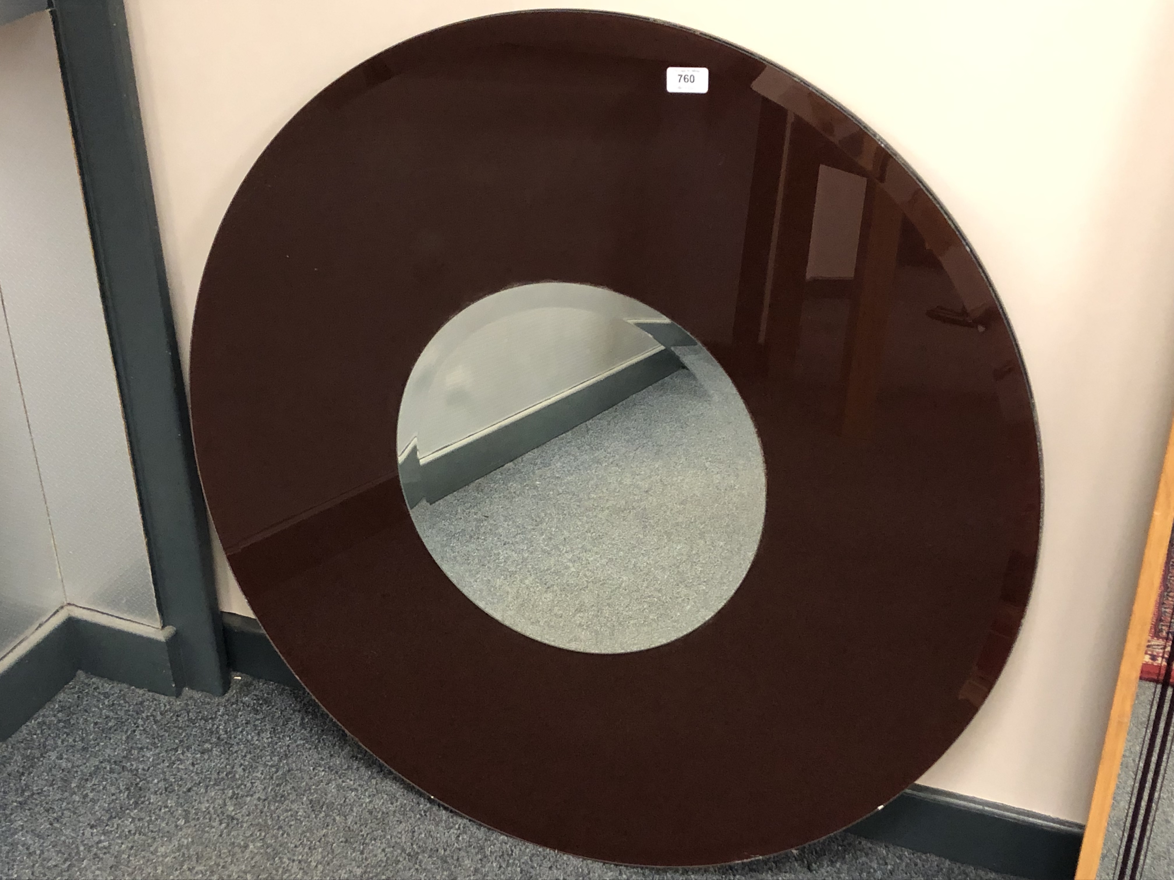 A two-tone circular mirror,