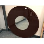 A two-tone circular mirror,