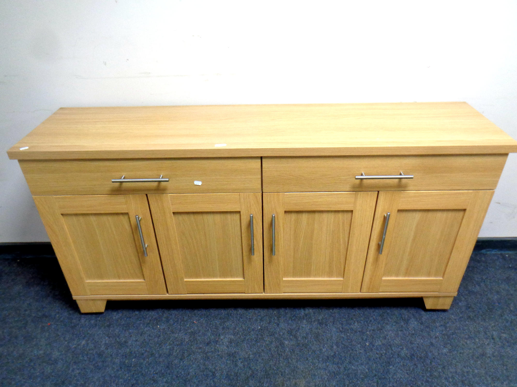 A contemporary four door sideboard fitted two drawers above,