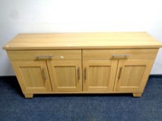 A contemporary four door sideboard fitted two drawers above,