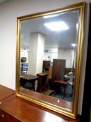 A gilt framed bevel edged overmantel mirror, glass 115.5 cm x 87.