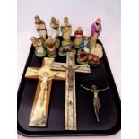 A tray containing religious items to include crucifixes, brass figure of Jesus,