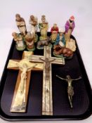 A tray containing religious items to include crucifixes, brass figure of Jesus,