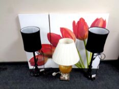 A three piece contemporary wall canvas together with a pair of black table lamps with shades and a