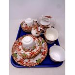 A tray containing a 21 piece antique bone china tea service