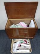 A mid 20th century blanket box containing assorted bed linen, table linen, pillows,