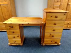 A pine single pedestal four drawer dressing table together with a narrow pine five drawer chest