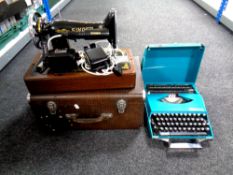 A 20th century cased Singer sewing machine with accessories (electrified) together with a Smith